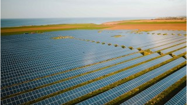 Solar panels in a field representing economic sustainability